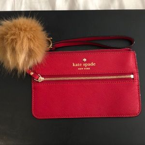 Red Kate Spade Wristlet with fake fur keychain